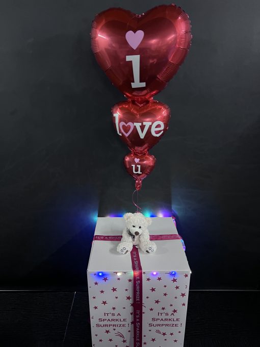 Triple foil heart balloon in a box and a teddy